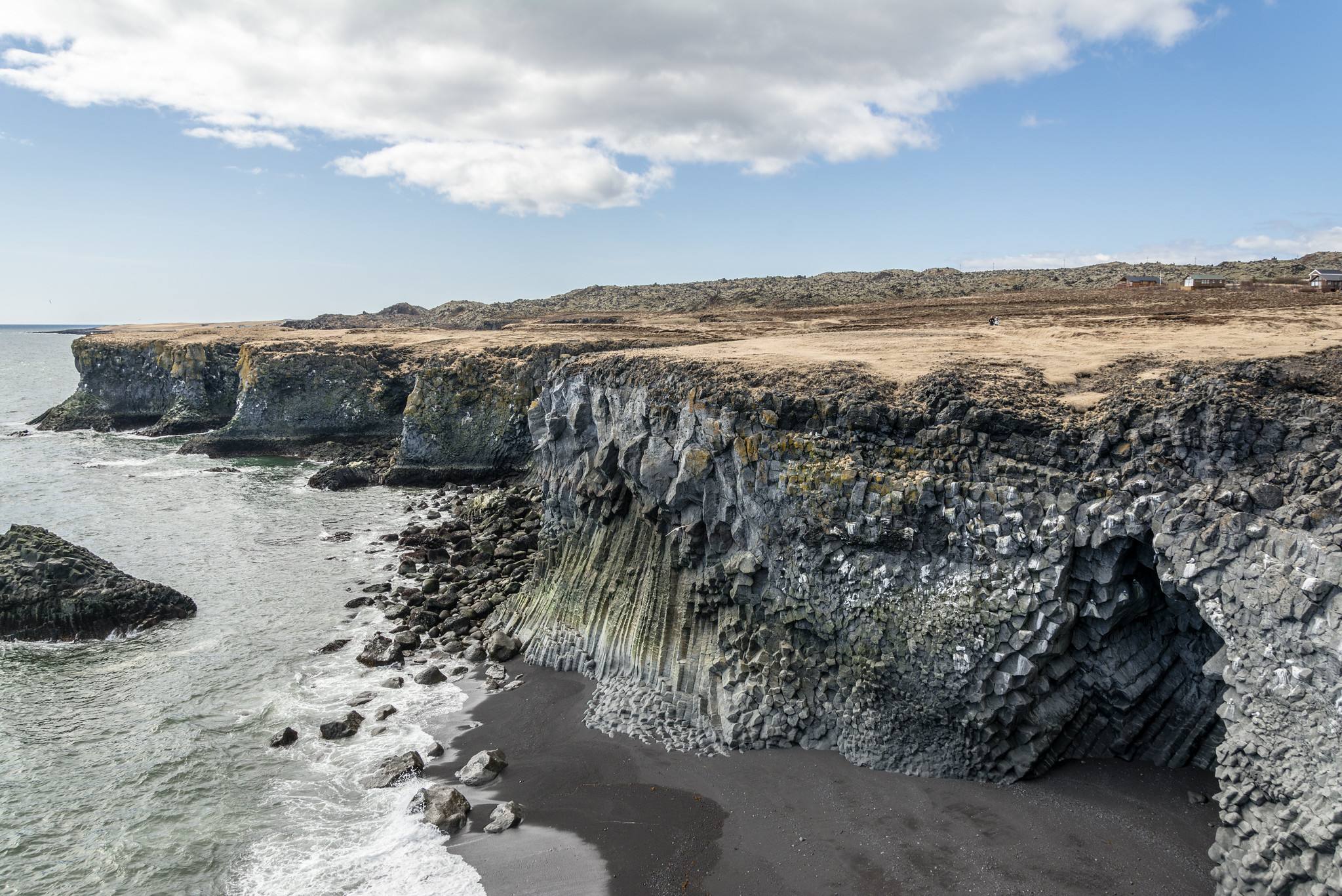 Basalt cliffs and a sea cave at Arnarstapi
