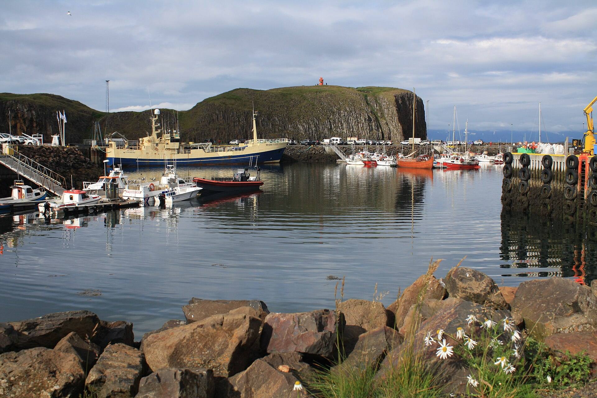 Boats in Stykkishólmur harbour, with Súgandisey and its lighthouse